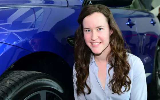 A headshot of Orla Murphy next to a blue car. 