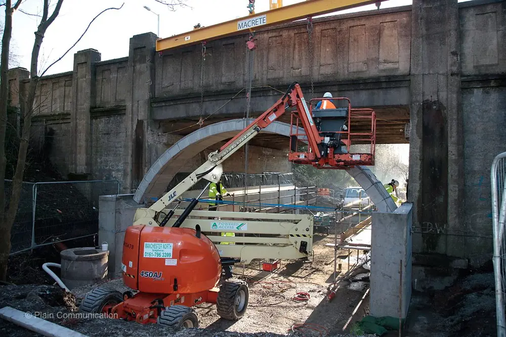 A crane and construction works around the Ashton bridge.
