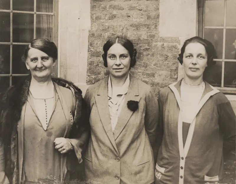 A monochrome photograph of Laura Willson, Dame Caroline Haslett DBE and Margaret Partridge.