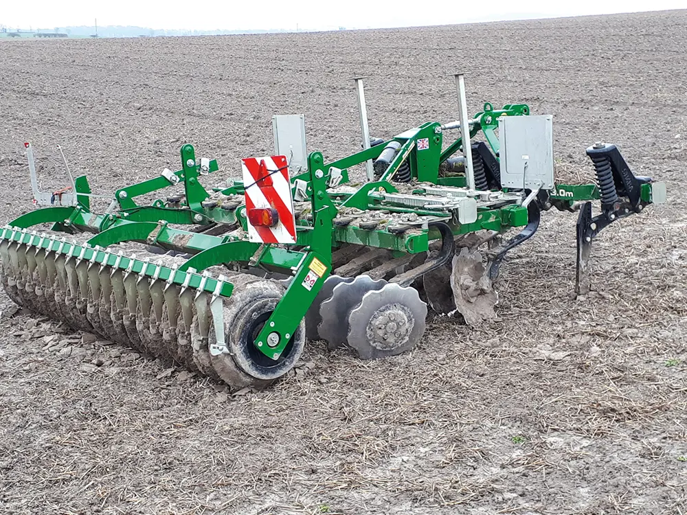 A photograph of the discs and tines of a plough.