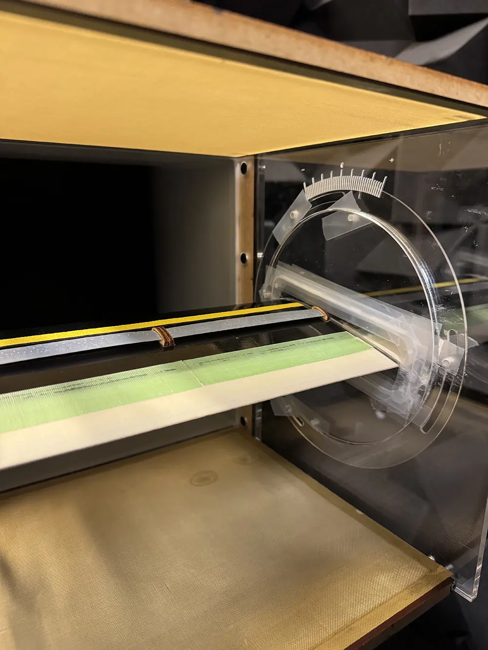 A model aeroplane wing is secured in a wind tunnel for testing