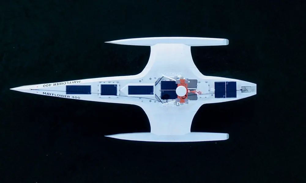 An aerial view of the mayflower submarine that has solar panels on it.
