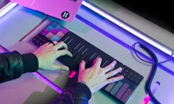Two hands playing the ROLI instrument, stretched out across the silicon touchpad.