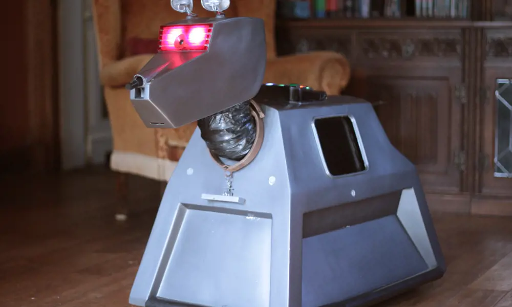 The robot dog K9 replica inside a house. 