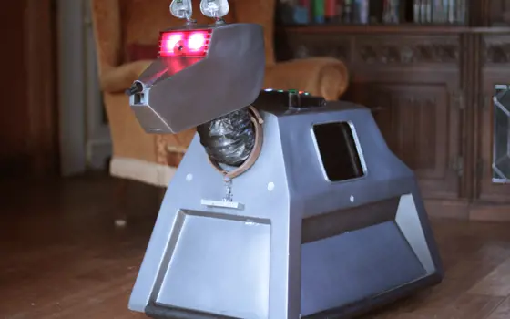 The robot dog K9 replica inside a house. 