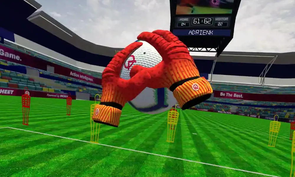 A screenshot from the VR game developed by INCISIV, showing a red and orange pair of virtual gloves catching a football in a stadium, from the gamer's perspective.