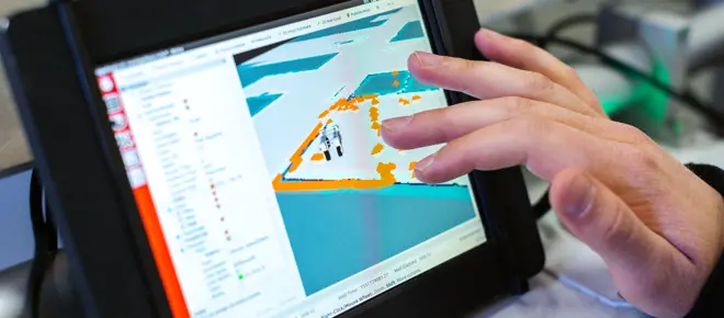 A tablet device shows data modelling onscreen, with a hand shown exploring the data by touching the screen 