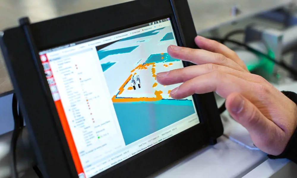 A tablet device shows data modelling onscreen, with a hand shown exploring the data by touching the screen 