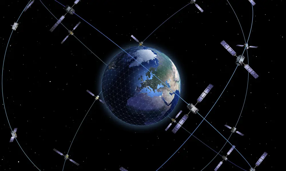 A schematic of Earth with 28 satellites orbiting in three orbital planes for the Galileo satellite navigation system.