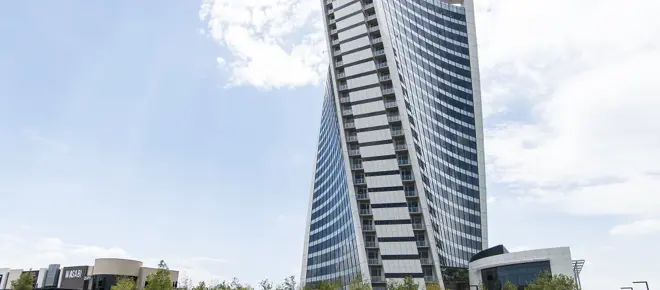 The tall, twisted PwC Tower in Johannesburg with many windows. 