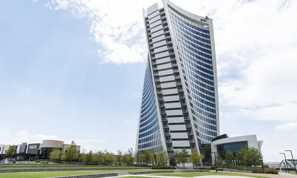 The tall, twisted PwC Tower in Johannesburg with many windows. 