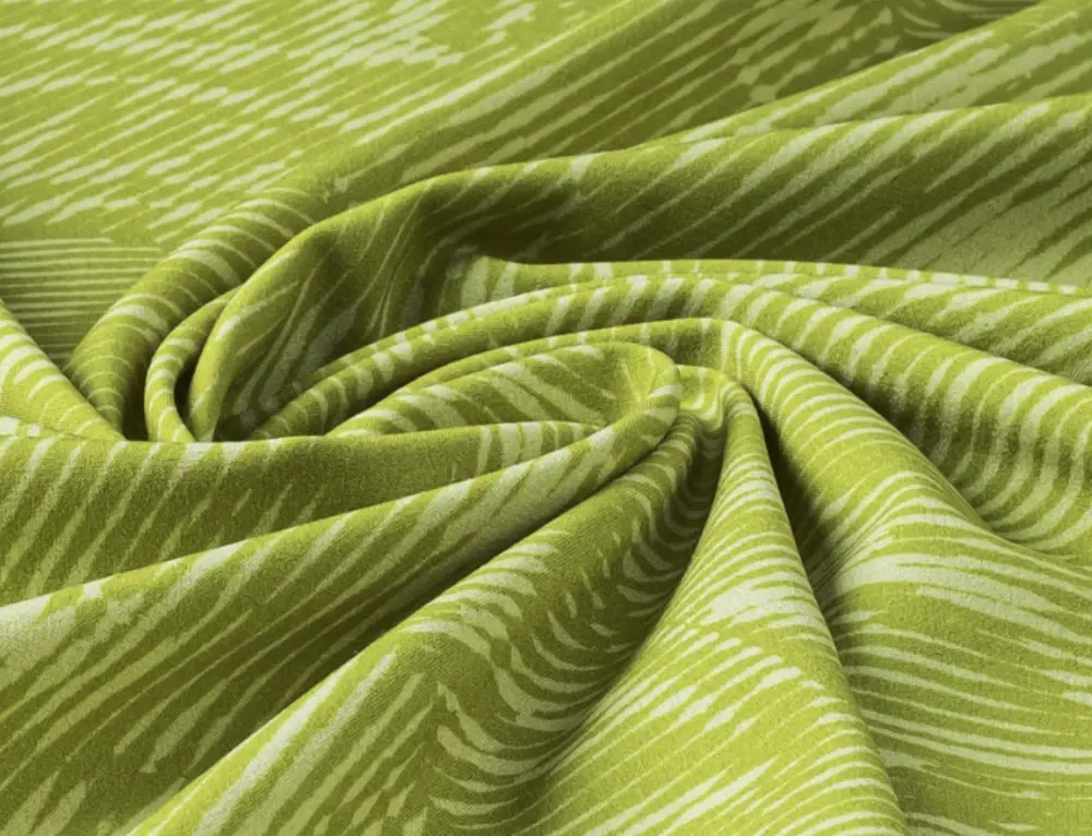  Green patterned fabric scrunched up in the middle.