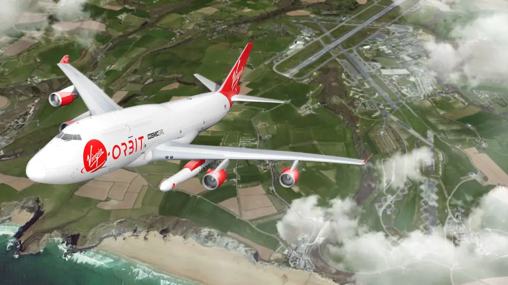 The Virgin Orbit Cosmic Girl plane flying above Earth, with Cornwall Spaceport in the background. 