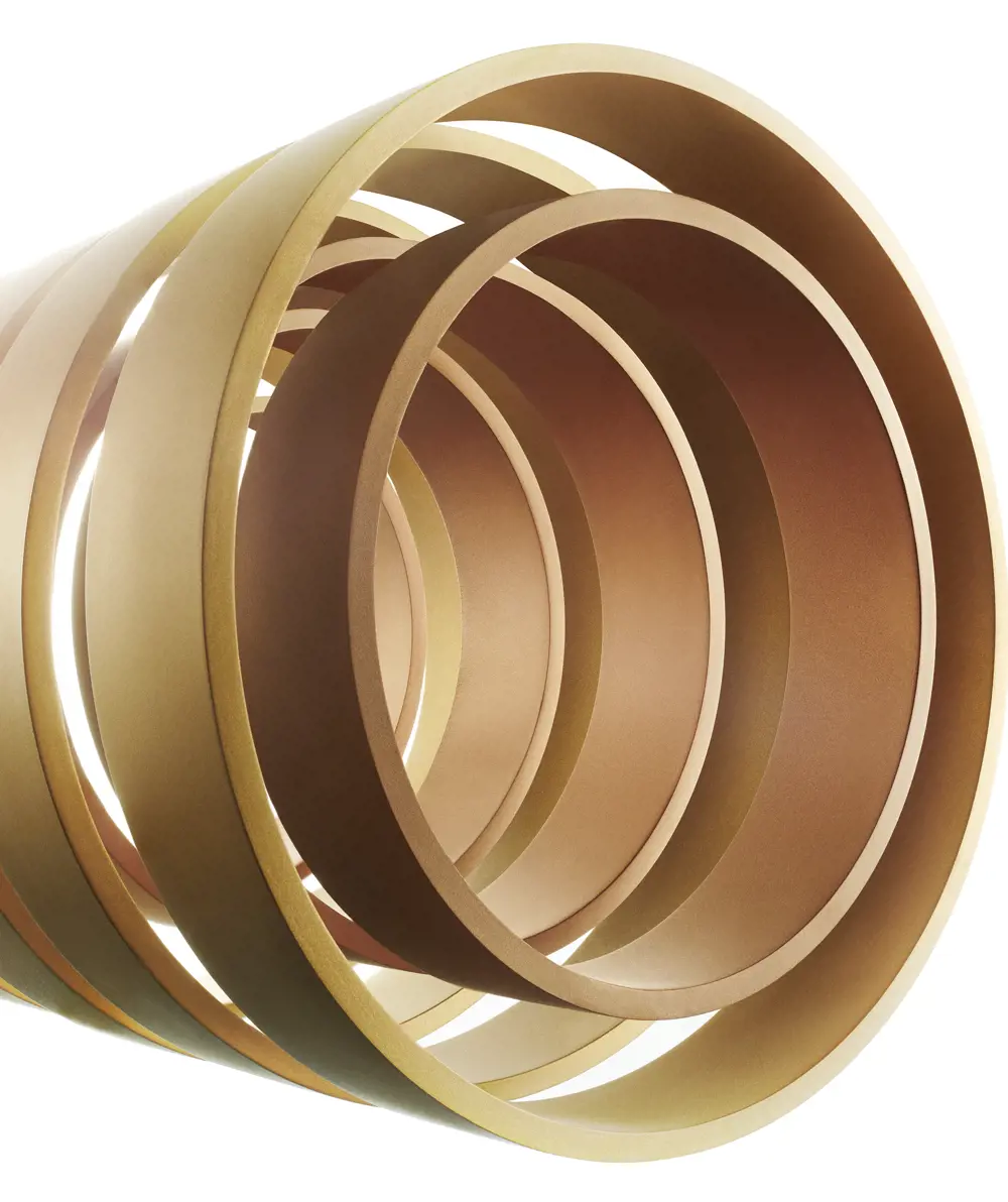 A number of gold-coloured cylinders are grouped together to look like a coiled spring