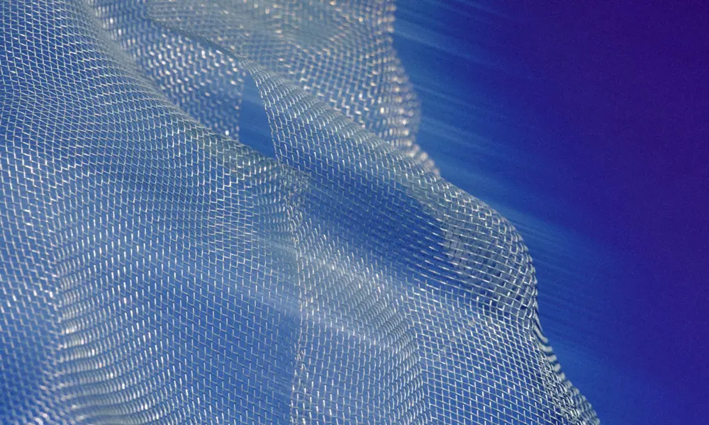 An abstract photo of a mesh, conceptualising the Internet of Things