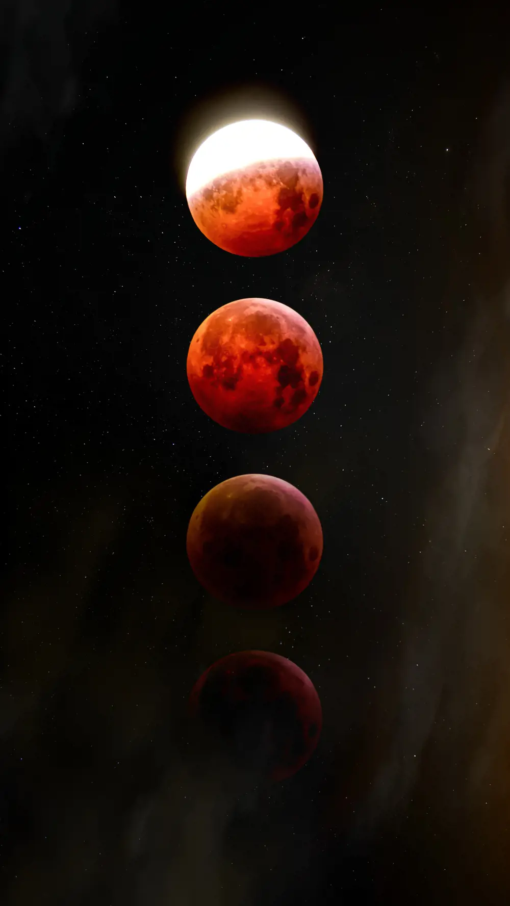 A time lapse image showing four Moons in the same photo frame, the top ones are coloured red and the bottom ones are slowly fading into the background.