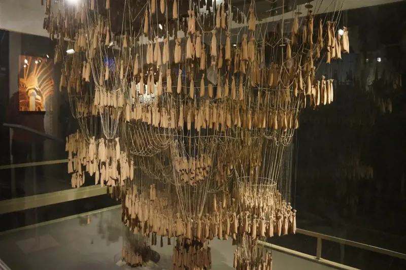 Gaudi's hanging chain model, using scale models made of weighted strings to form inverted catenary curves.