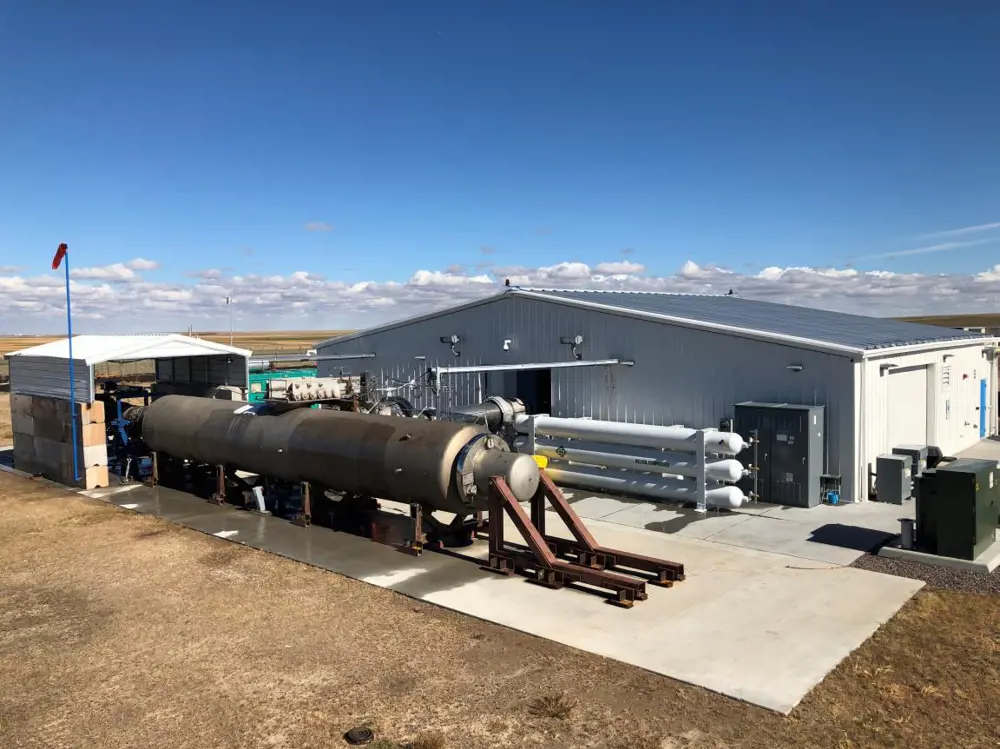 The Reaction Engine's test facility in Denver, Colorado showing a General Electric J79 jet engine in front of a shed.
