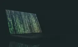 A laptop with green dotted vertical lines taking up the screen.