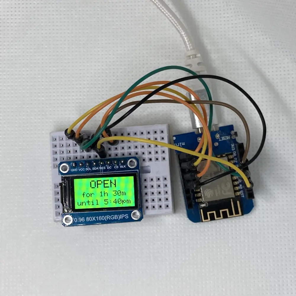 A prototype of the HICI box. A microcontroller is displaying a status as 'OPEN' based on the time. The display shows the words 'OPEN' for 1h30 until 5:40pm. 