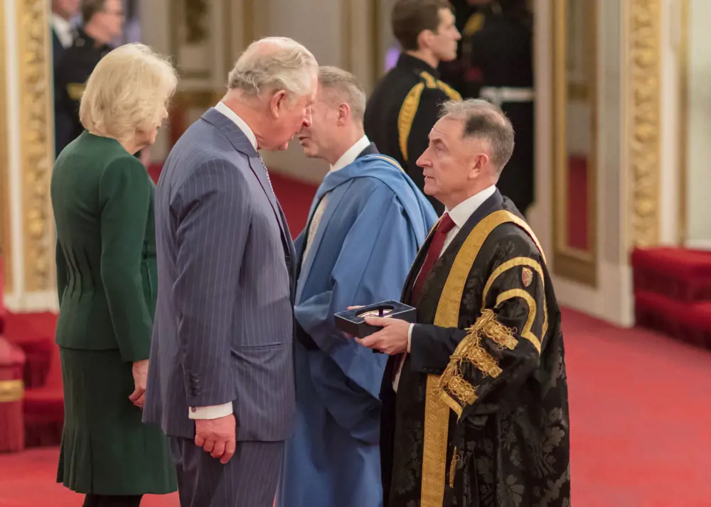 Sir Jim McDonald receiving the Queen's Anniversary Prize from His Royal Highness The Prince of Wales. 