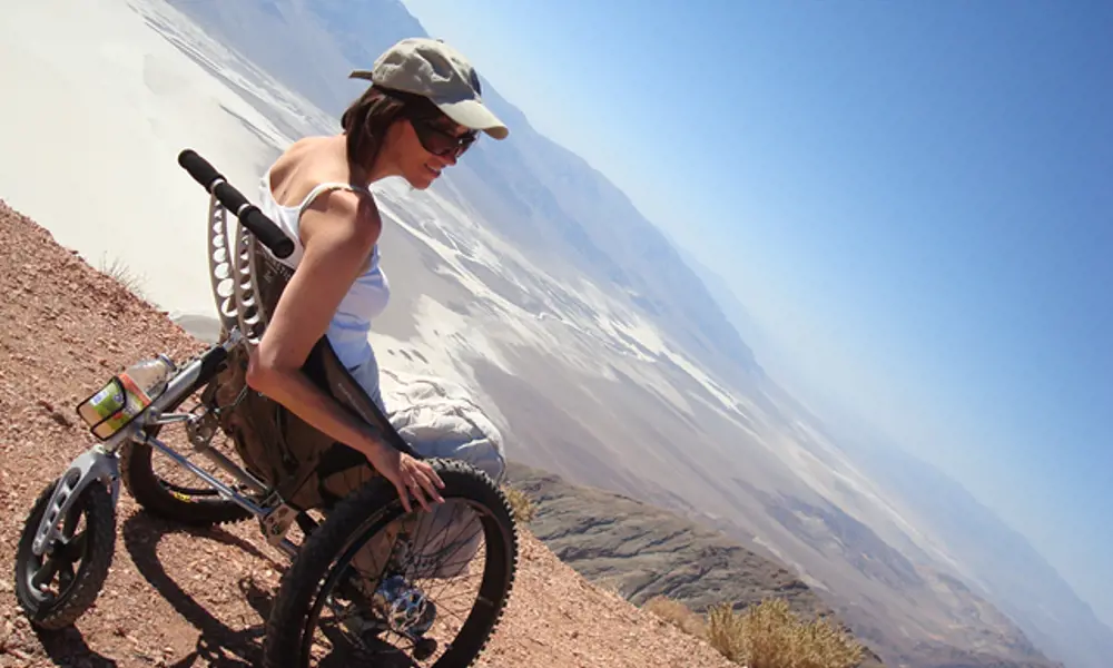 A lady sitting in a Trekinetic wheelchair at Death Valley National Park in California.