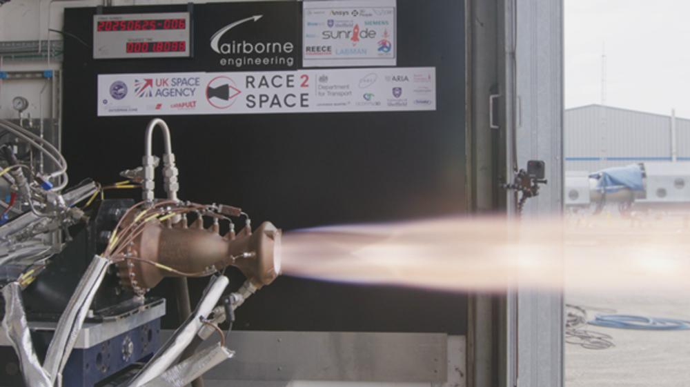 Rocket engine firing during a ground test, with a bright exhaust flame extending from the nozzle inside a test facility.