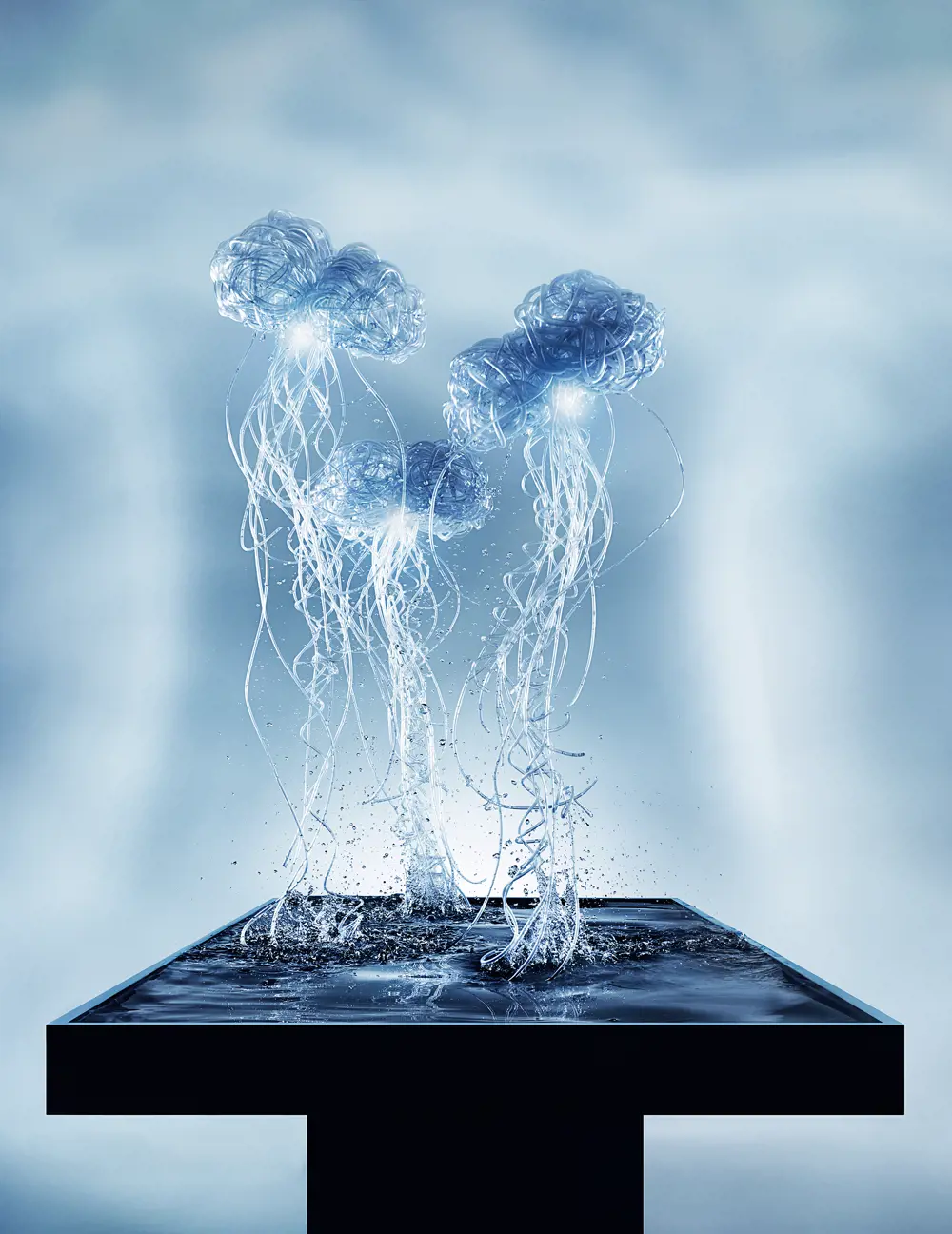 Three jellyfish shapes, created from clear plastic tubing, rise out of a black table filled with water, creating splashes